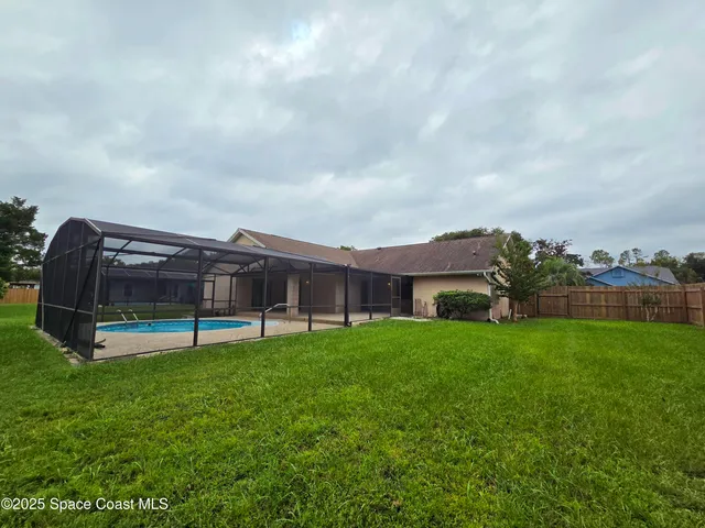 a view of backyard with green space