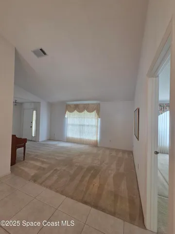 a view of an empty room and window