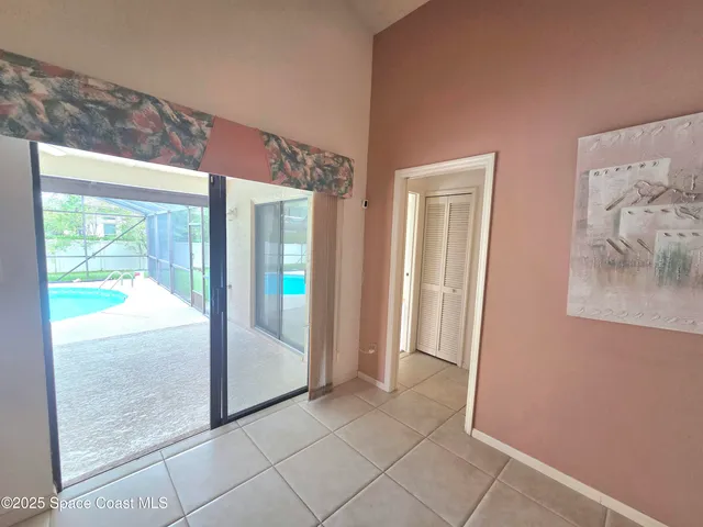 a view of a hallway view with wooden floor and bathroom