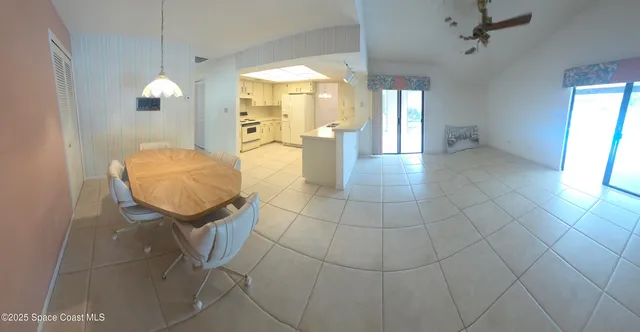 a view of a kitchen with furniture window and wooden floor