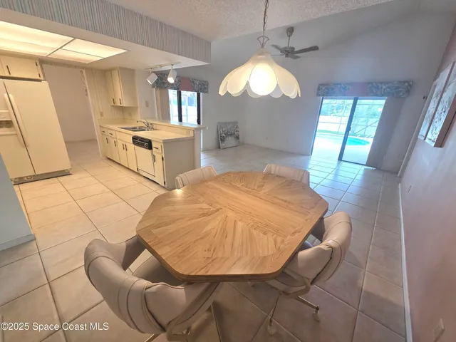 a kitchen with a stove and white cabinets