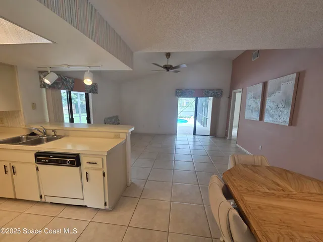 a spacious bathroom with a mirror a bathtub and shower