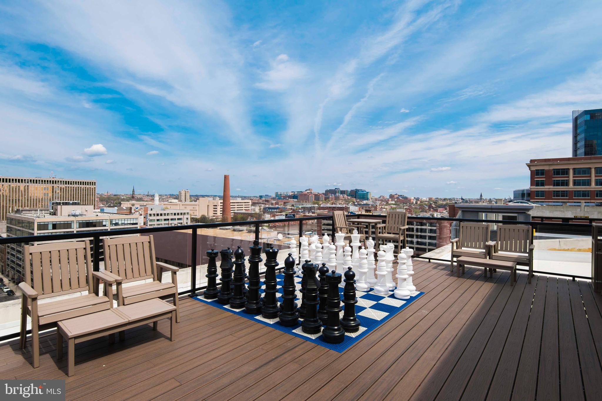 103 South Gay Street, Unit 1BR Baltimore, MD 21202 - Photo 32 of 92 a view of a balcony with wooden floor outdoor seating and city view