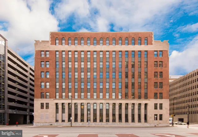 a view of a hallway with chandelier