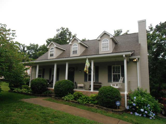 1015 Anderson Road Dickson, TN 37055 - Photo 1 of 20 a view of a white house next to a yard with potted plants