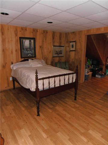 1015 Anderson Road Dickson, TN 37055 - Photo 15 of 20 a bed sitting in a room next to a window