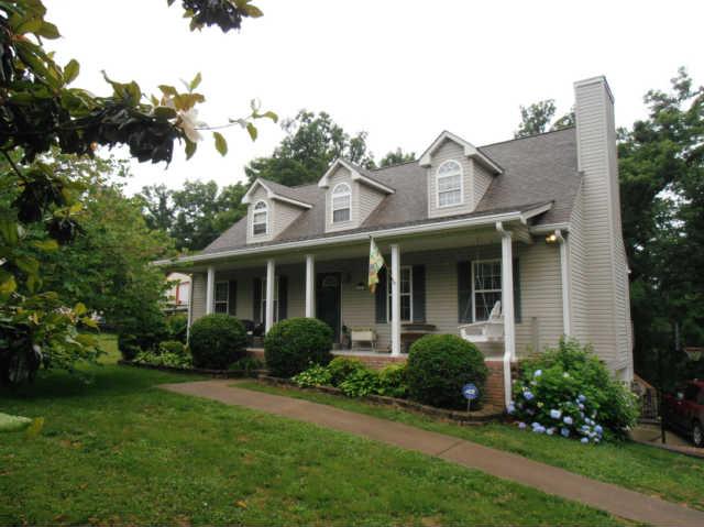1015 Anderson Road Dickson, TN 37055 - Photo 2 of 20 a front view of a house with a yard and trees