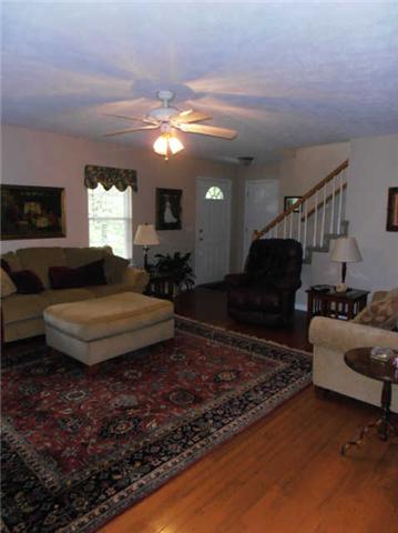 1015 Anderson Road Dickson, TN 37055 - Photo 4 of 20 a living room with furniture rug and a window