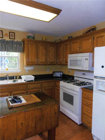 1015 Anderson Road Dickson, TN 37055 - Photo 7 of 20 a kitchen with granite countertop a stove and a sink
