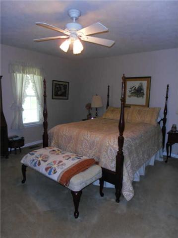 1015 Anderson Road Dickson, TN 37055 - Photo 10 of 20 a bed sitting in a bedroom next to a window
