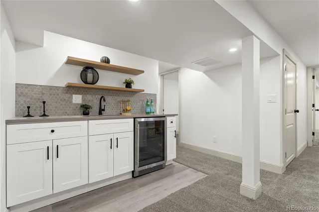 a kitchen with cabinets and window