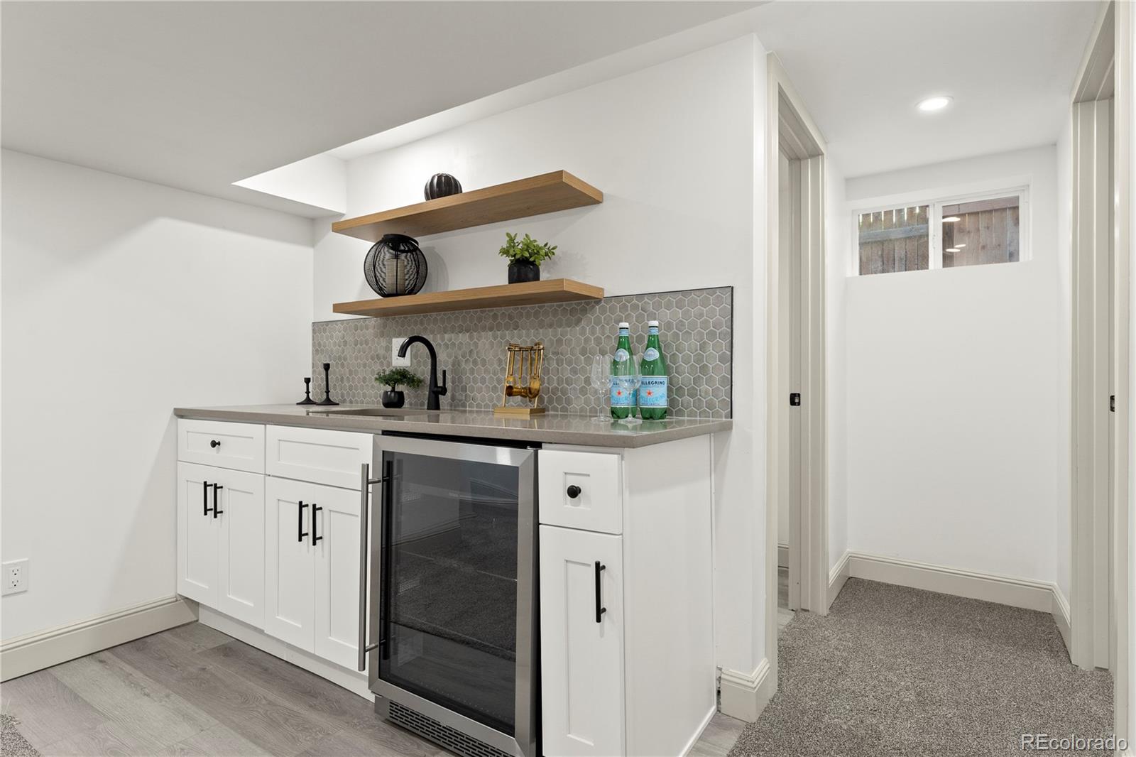 2963 South Lincoln Street Englewood, CO 80113 - Photo 26 of 50 a kitchen with a sink dishwasher and cabinets