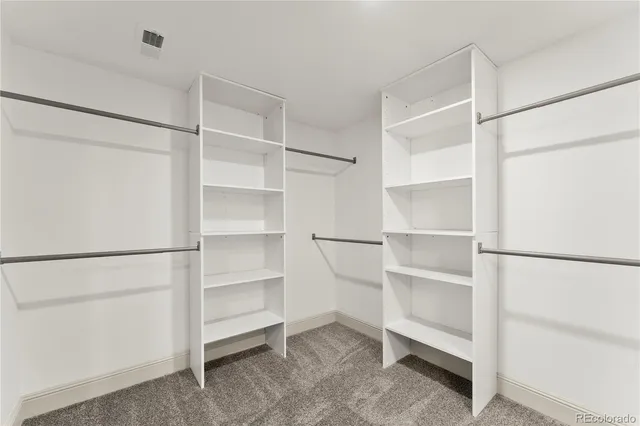 a view of an empty walk in closet