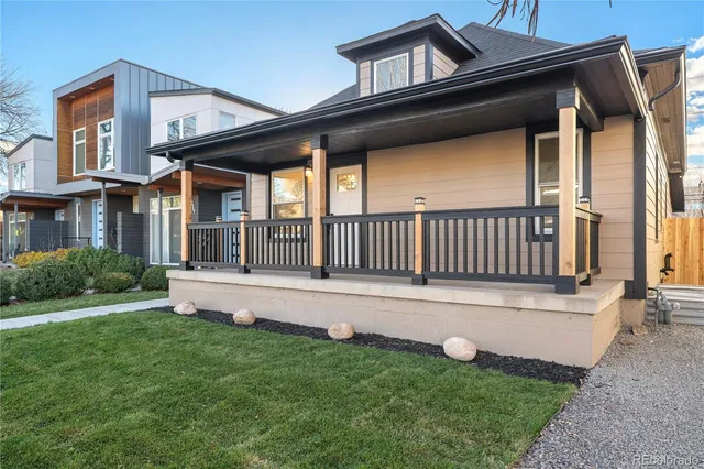 a view of an house with backyard and porch