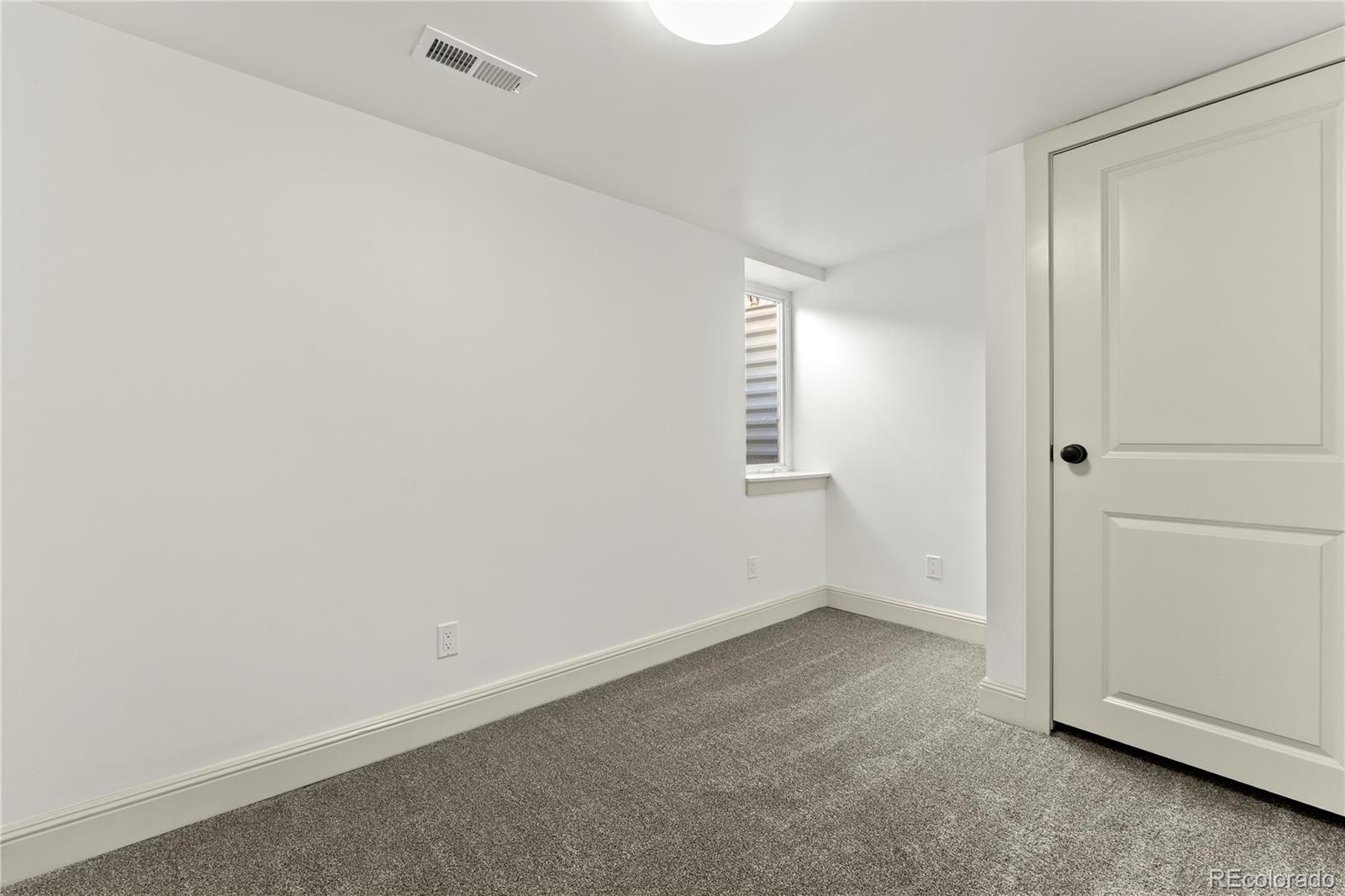 2963 South Lincoln Street Englewood, CO 80113 - Photo 33 of 50 an empty room with windows