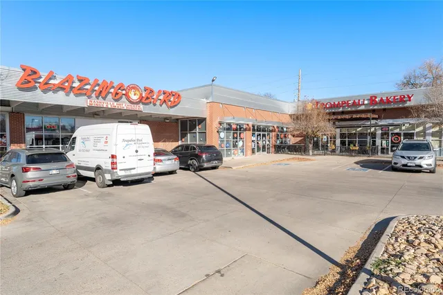 a view of a street with a building in the background