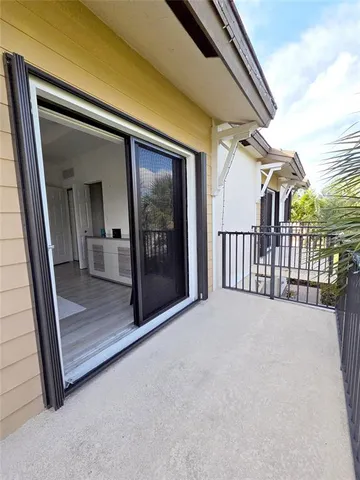 a view of a glass door with a balcony