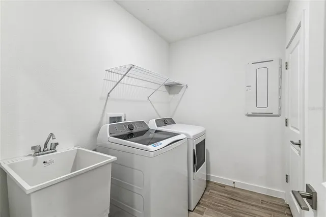 a bathroom with a double vanity sink and mirror
