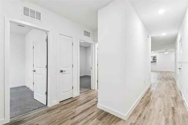 a view of kitchen with a sink and a refrigerator