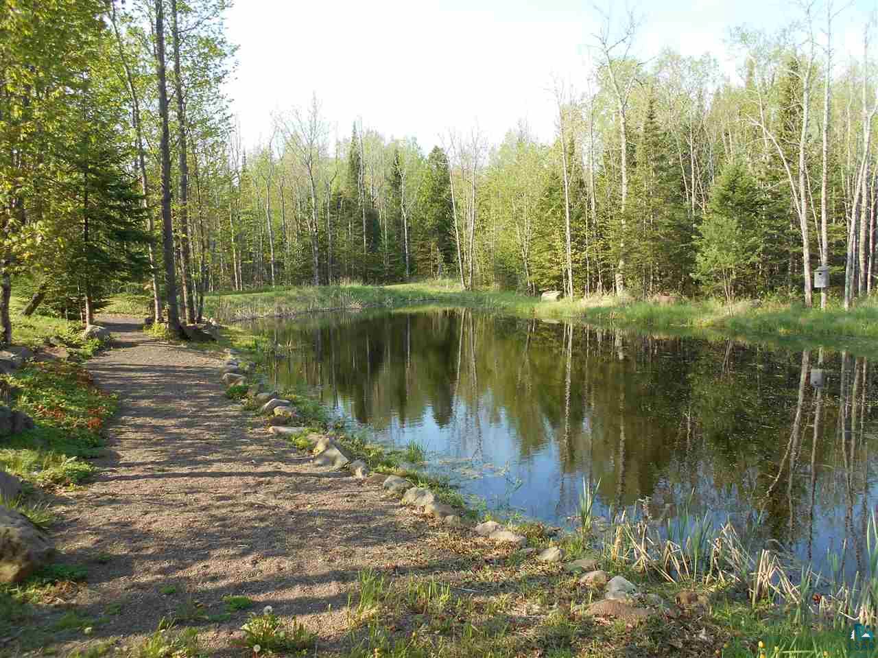 2783 Clark Road Two Harbors, MN 55616 - Photo 8 of 24 pond with rock path