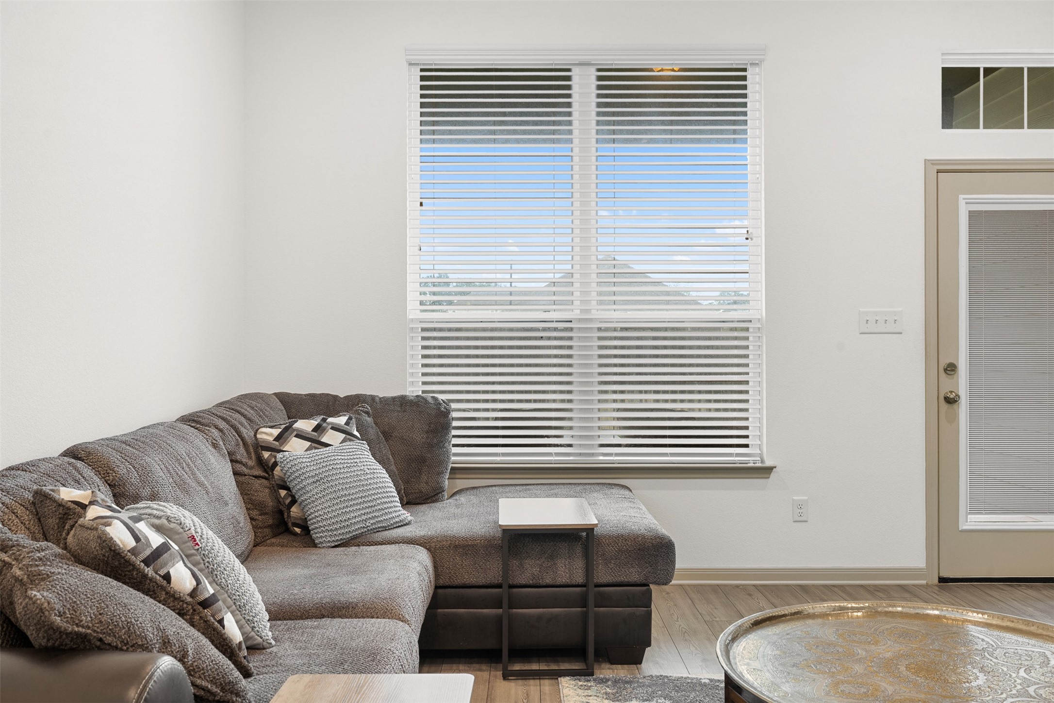 1968 Chief Street Bryan, TX 77807 - Photo 22 of 27 This bright living room features large windows with blinds for ample natural light.