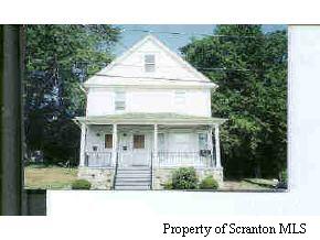 a view of house with yard