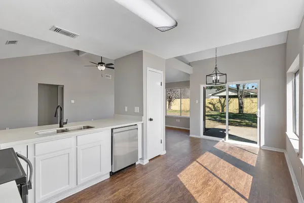 a bathroom with a double vanity sink and mirror