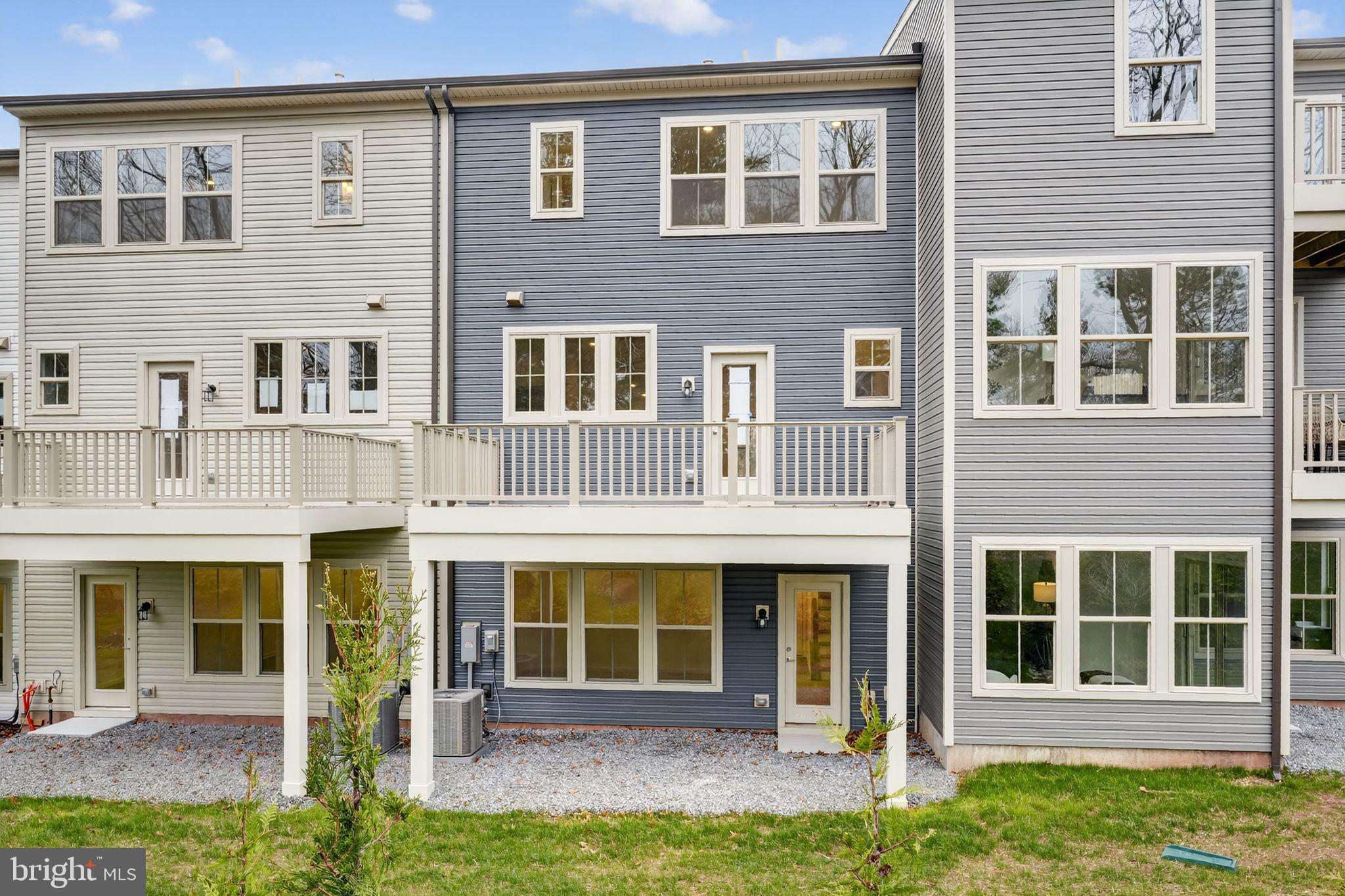 103 Beacon Court, Unit 10102 Lansdale, PA 19446 - Photo 3 of 17 a front view of a house with a yard