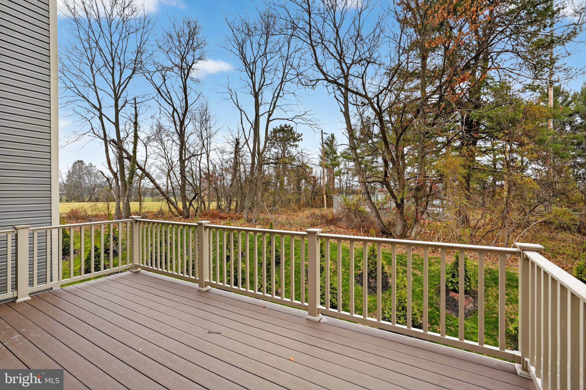 103 Beacon Court, Unit 10102 Lansdale, PA 19446 - Photo 4 of 17 a view of balcony with wooden floor and fence