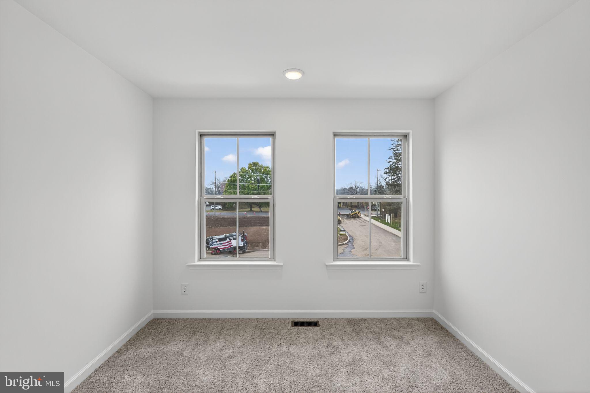 103 Beacon Court, Unit 10102 Lansdale, PA 19446 - Photo 8 of 17 an empty room with a window