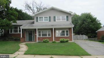 1408 Mt Airy Road Rosedale, MD 21237 - Photo 1 of 22 front view of a house with a yard
