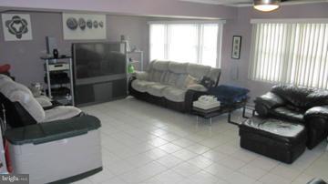1408 Mt Airy Road Rosedale, MD 21237 - Photo 12 of 22 a living room with furniture and a window