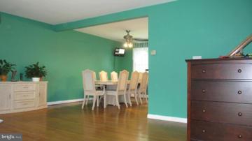 1408 Mt Airy Road Rosedale, MD 21237 - Photo 13 of 22 a dining room with furniture and wooden floor