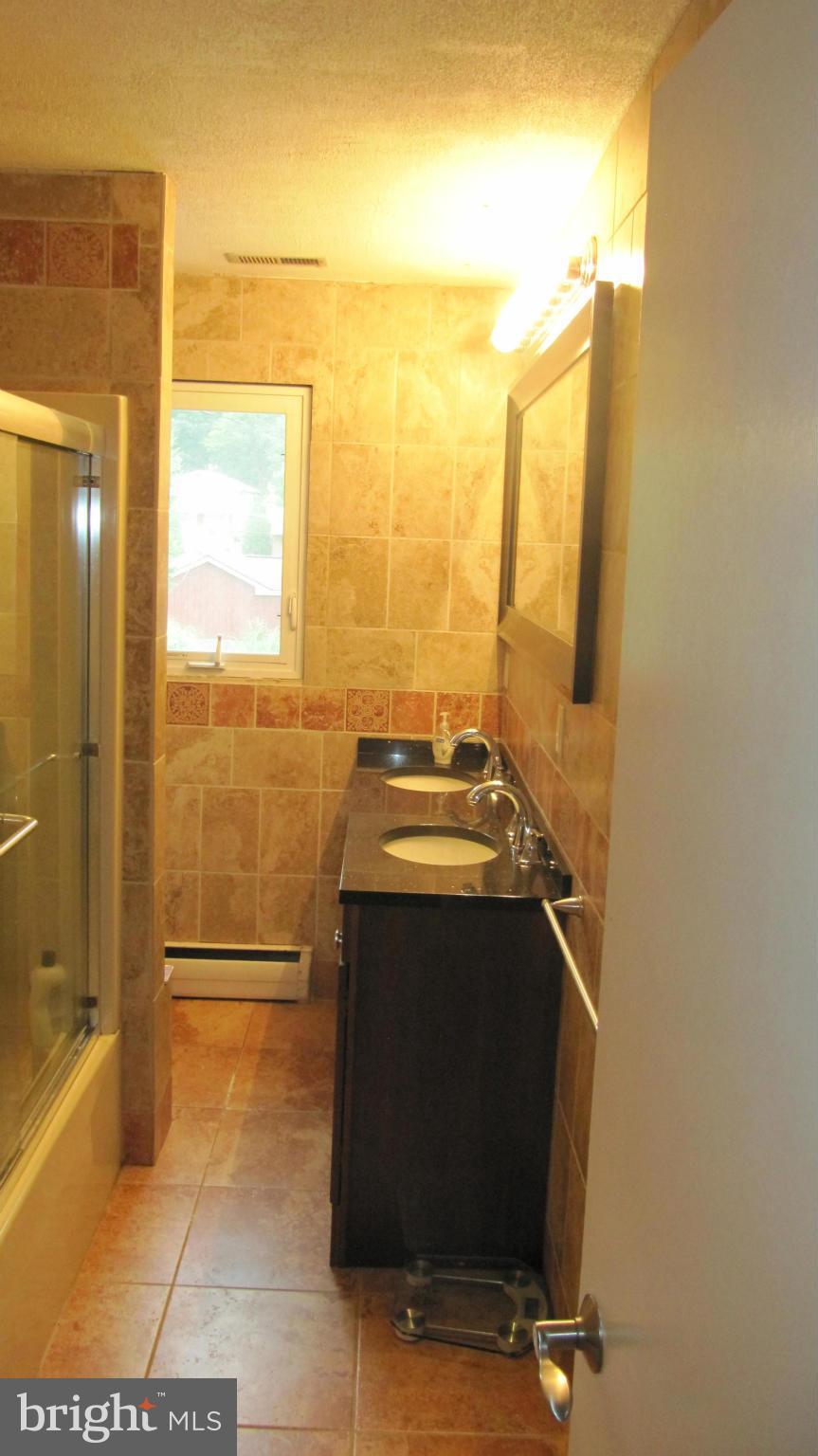 1408 Mt Airy Road Rosedale, MD 21237 - Photo 17 of 22 a view of bathroom with a bathtub