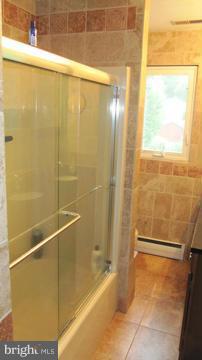 1408 Mt Airy Road Rosedale, MD 21237 - Photo 18 of 22 a bathroom with a bathtub