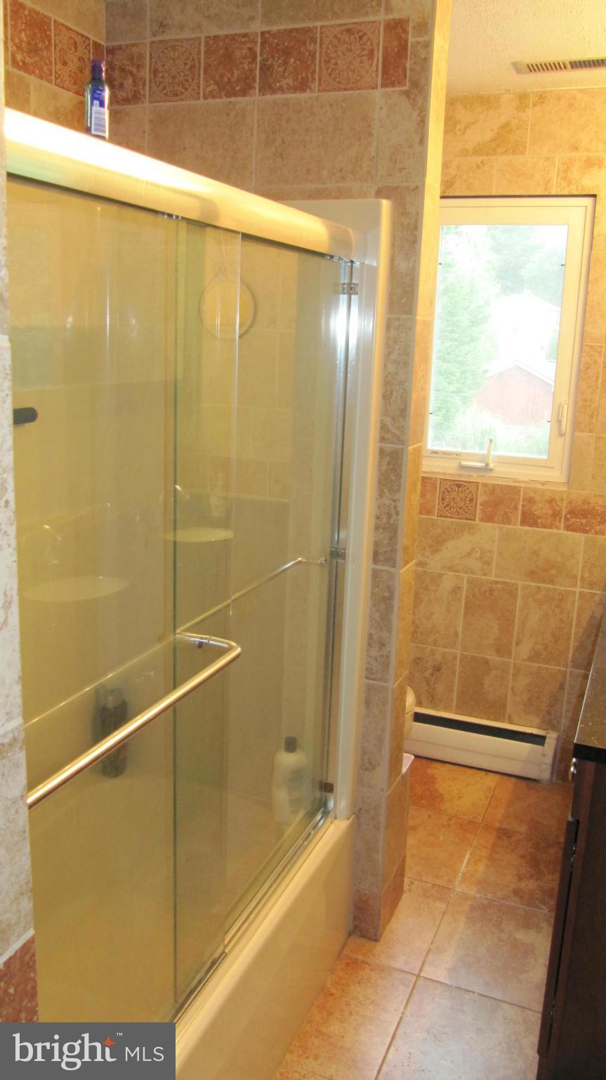 1408 Mt Airy Road Rosedale, MD 21237 - Photo 19 of 22 a bathroom with a shower