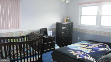 1408 Mt Airy Road Rosedale, MD 21237 - Photo 22 of 22 a bedroom with a bed and a window