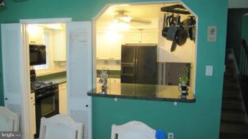 1408 Mt Airy Road Rosedale, MD 21237 - Photo 5 of 22 a bathroom with a sink and mirror