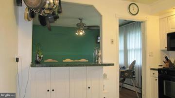 1408 Mt Airy Road Rosedale, MD 21237 - Photo 8 of 22 a bathroom with a sink and mirror