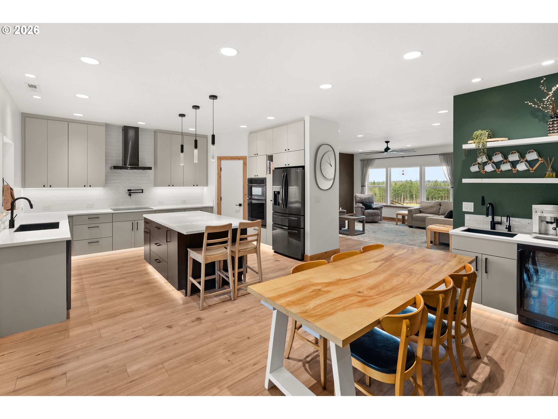 527 Tennessee Road Winlock, WA 98596 - Photo 15 of 48 a dining room with stainless steel appliances kitchen island granite countertop a table chairs and a kitchen view