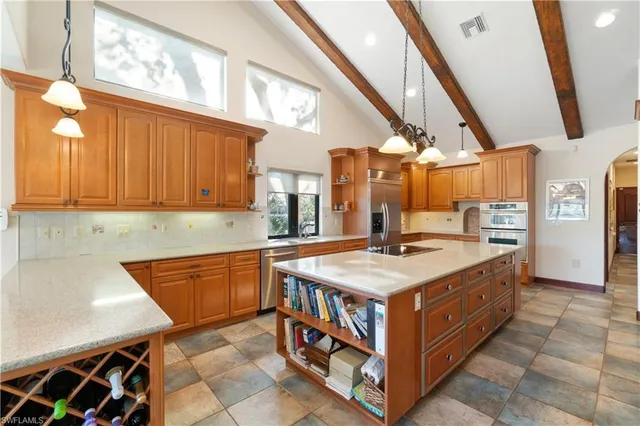 a kitchen with stainless steel appliances granite countertop a stove and a sink