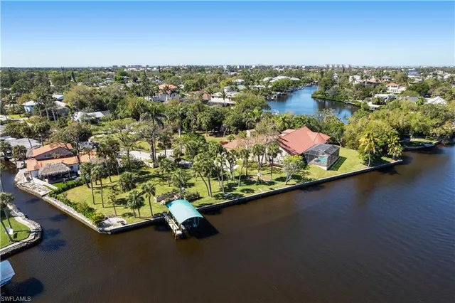 an aerial view of a houses with a lake view