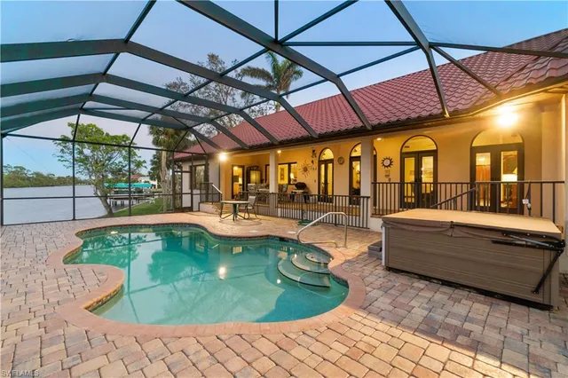 a view of a swimming pool with a patio