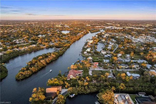 an aerial view of a city with ocean view