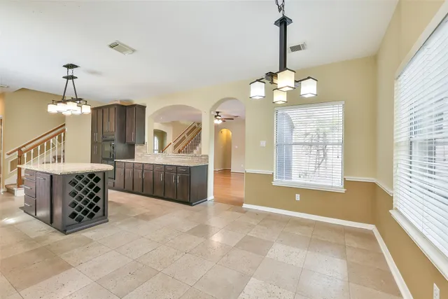 a view of an entryway with chandelier