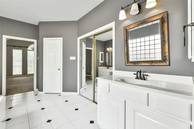a bathroom with a sink and a mirror