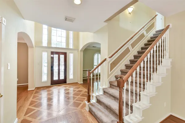 a view of an entryway with wooden floor