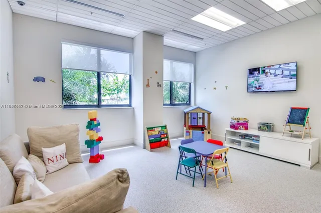 a view of a living room and kitchen