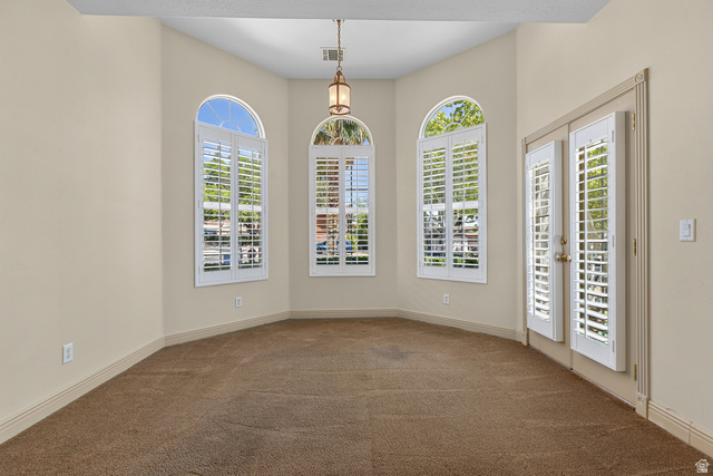 389 North Main Street St. George, UT 84770 - Photo 11 of 44 Unfurnished room with dark colored carpet and baseboards