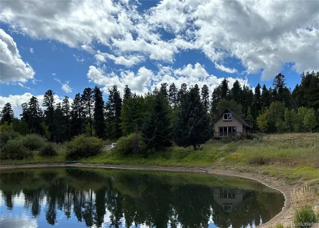 a view of lake with green space